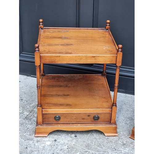 1038 - A pair of reproduction yew wood two-tier low occasional tables, 49.5cm wide.