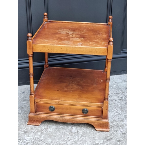 1038 - A pair of reproduction yew wood two-tier low occasional tables, 49.5cm wide.