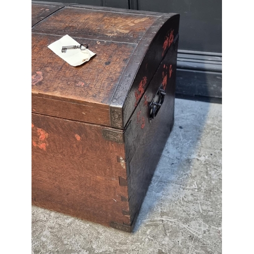 1041 - A Victorian oak and metal bound dome top chest, 70cm wide.