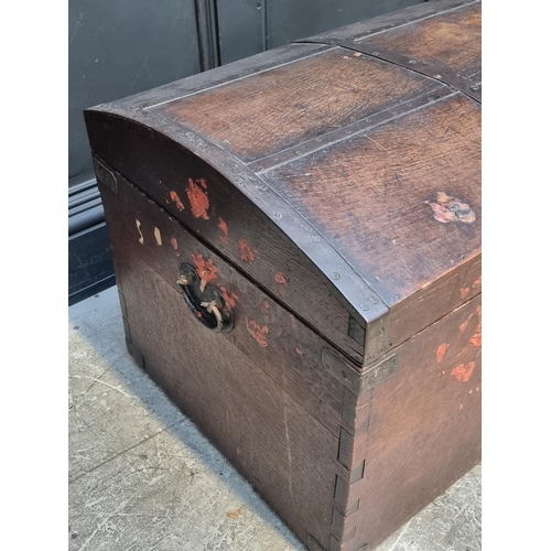 1041 - A Victorian oak and metal bound dome top chest, 70cm wide.