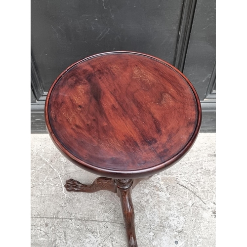 1044 - A mahogany tripod wine table, 33cm wide.