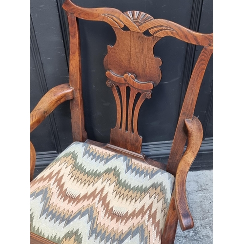 1050 - A George III elm elbow dining chair, with an unusual vase splat; together with another mahogany exam... 