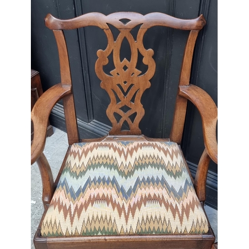 1050 - A George III elm elbow dining chair, with an unusual vase splat; together with another mahogany exam... 