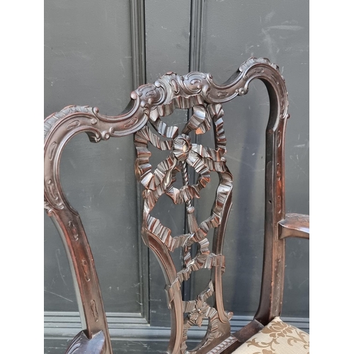 1051 - An antique Chippendale style carved mahogany elbow chair.