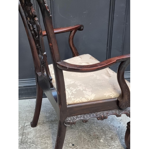 1051 - An antique Chippendale style carved mahogany elbow chair.