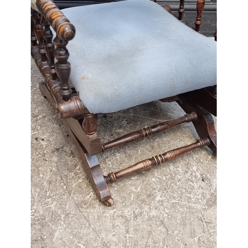 1056 - A circa 1900 American stained beech rocking chair.