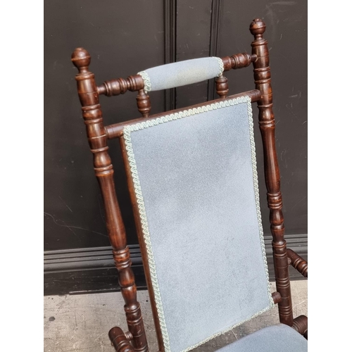 1056 - A circa 1900 American stained beech rocking chair.