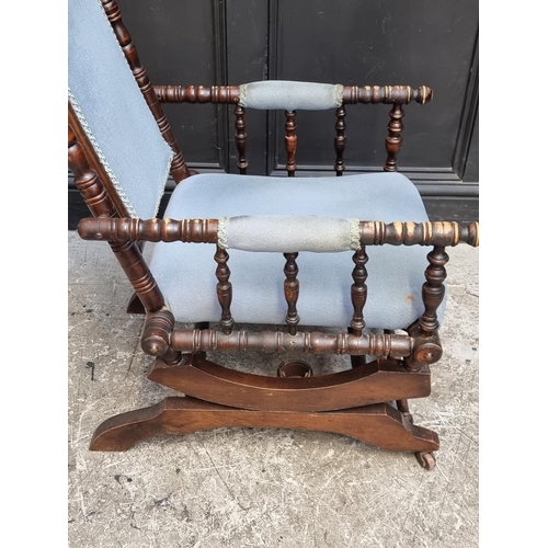 1056 - A circa 1900 American stained beech rocking chair.