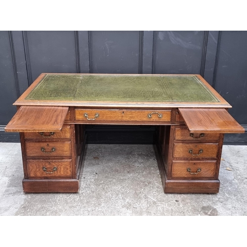 1069 - An Edwardian oak pedestal desk, 152cm wide.