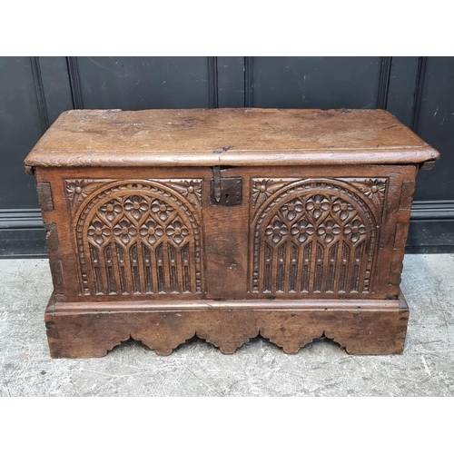 1071 - An interesting Continental 16th century carved oak and elm coffer, probably Flemish, 108.5cm wide.... 