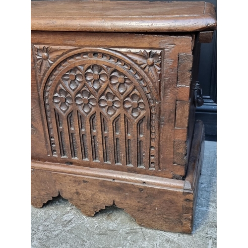 1071 - An interesting Continental 16th century carved oak and elm coffer, probably Flemish, 108.5cm wide.... 