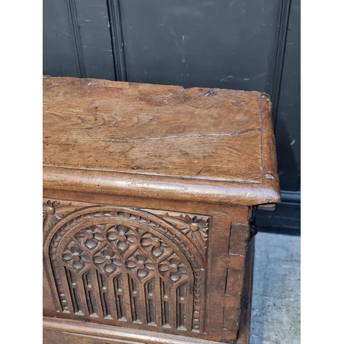 1071 - An interesting Continental 16th century carved oak and elm coffer, probably Flemish, 108.5cm wide.... 