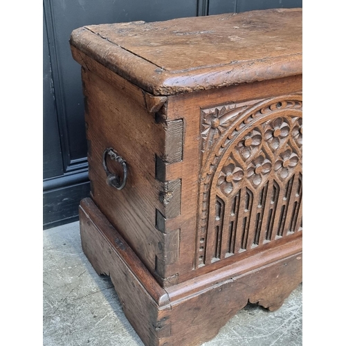 1071 - An interesting Continental 16th century carved oak and elm coffer, probably Flemish, 108.5cm wide.... 