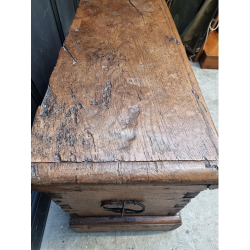 1071 - An interesting Continental 16th century carved oak and elm coffer, probably Flemish, 108.5cm wide.... 