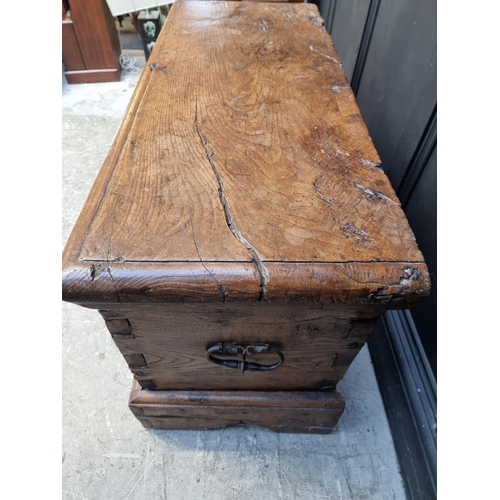 1071 - An interesting Continental 16th century carved oak and elm coffer, probably Flemish, 108.5cm wide.... 