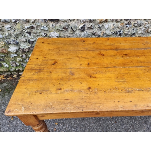 1072 - A Victorian pine kitchen table, with a lateral frieze drawer, 168.5cm long.