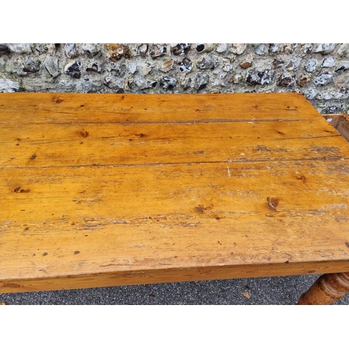 1072 - A Victorian pine kitchen table, with a lateral frieze drawer, 168.5cm long.