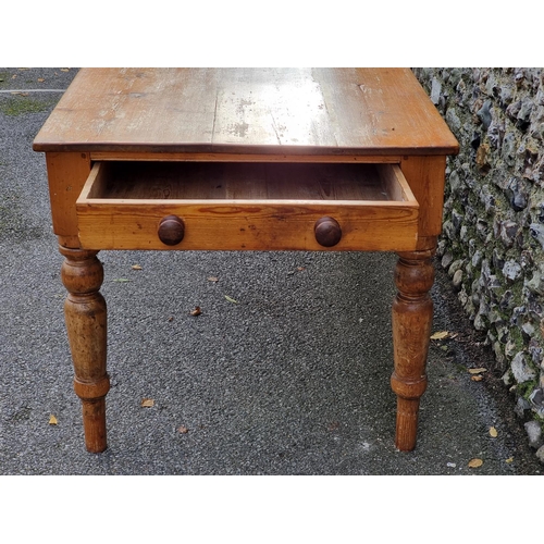 1072 - A Victorian pine kitchen table, with a lateral frieze drawer, 168.5cm long.