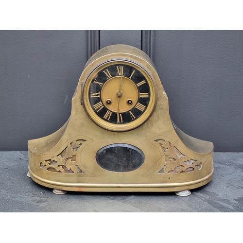 1082 - A late 19th century brass mantel clock, 39cm wide, with pendulum.