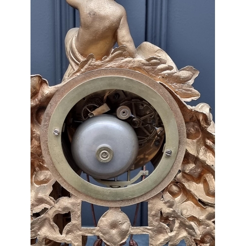 1083 - A gilt painted spelter mantel clock, 38.5cm wide, with pendulum.