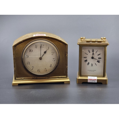 1090 - An old brass carriage timepiece, height including handle 14cm; together with another brass mantel ti... 