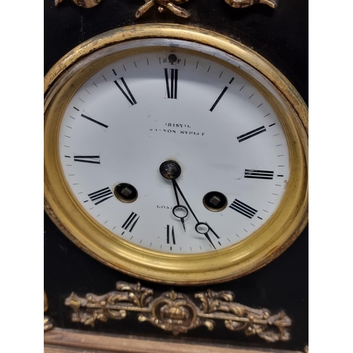 1091 - A late 19th century ebonised and brass mantle clock, the enamel dial inscribed 'Christie, Canno... 