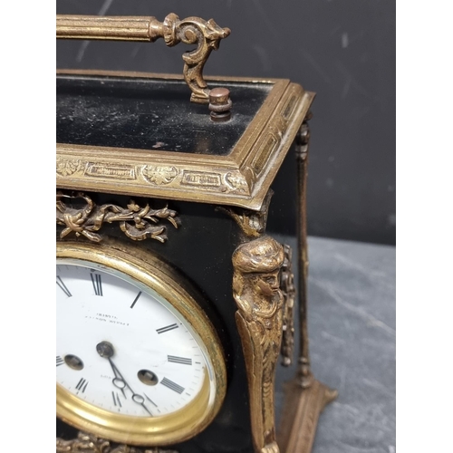 1091 - A late 19th century ebonised and brass mantle clock, the enamel dial inscribed 'Christie, Canno... 