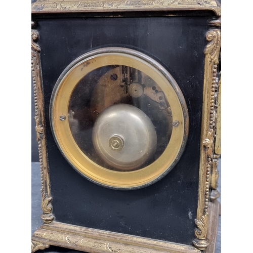 1091 - A late 19th century ebonised and brass mantle clock, the enamel dial inscribed 'Christie, Canno... 