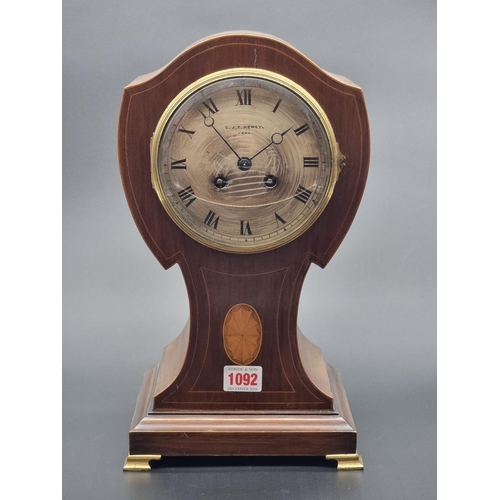 1092 - An Edwardian mahogany and inlaid balloon mantel clock, 34.5cm high, with pendulum.