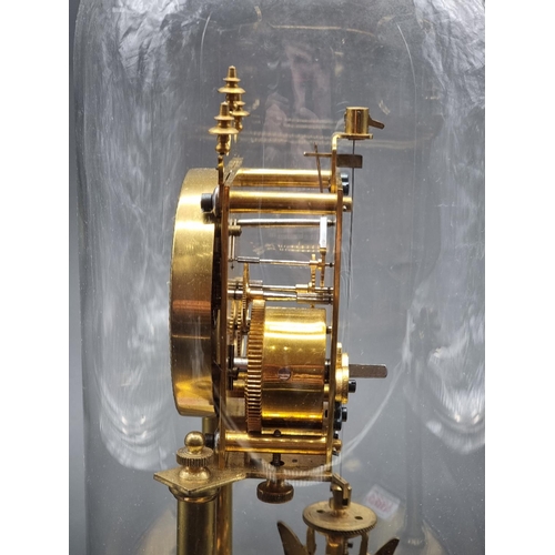 1093 - A brass anniversary timepiece, with glass dome, 32.5cm high.