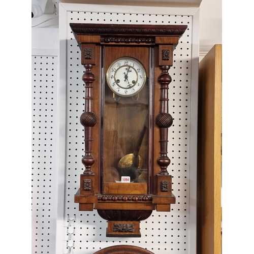 1094 - A late 19th century walnut Vienna style wall clock, spring driven, (lacking pediment), 74cm high, wi... 