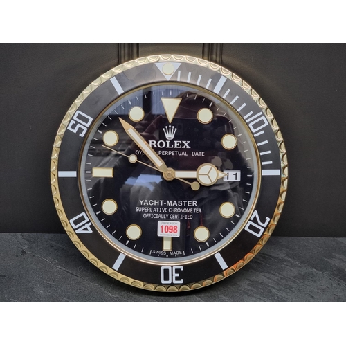 1098 - A Rolex style 'Yacht Master' wall clock, with battery movement, 34cm diameter.