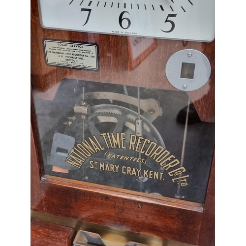 1099 - A National Time Recorder clocking in clock, 98.5cm high.