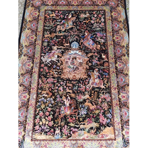 1100 - A fine Persian silk rug, decorated with hunting scene to central field, 167 x 105cm.... 