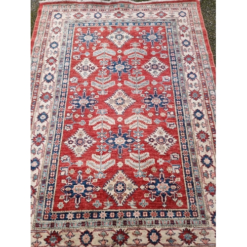 1101 - A Persian rug, having floral and geometric decoration, 208 x 155cm. 