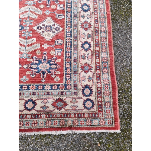 1101 - A Persian rug, having floral and geometric decoration, 208 x 155cm. 