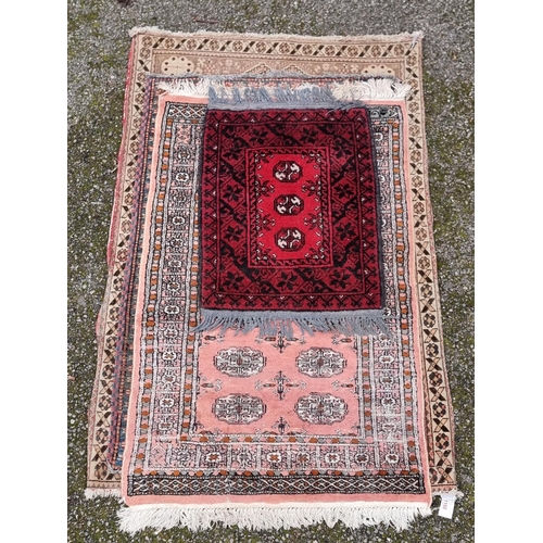 1102 - A group of four Persian rugs, largest, 147 x 95cm.