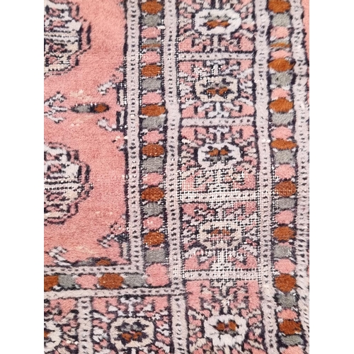 1102 - A group of four Persian rugs, largest, 147 x 95cm.