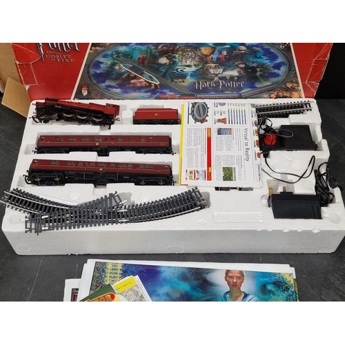 1300 - Harry Potter: a Hornby Hogwarts Express electric train set, with playmat, r1067, in box.... 