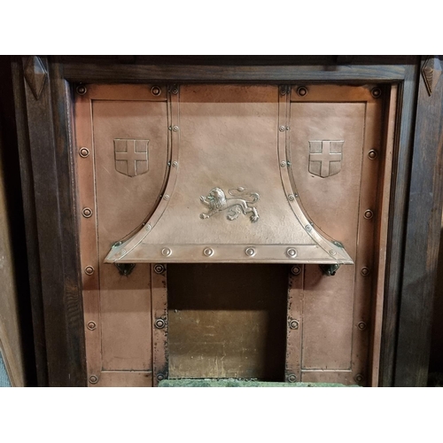 1694 - An oak and copper fireplace, the aperture of oak surround 111 x 97cm.