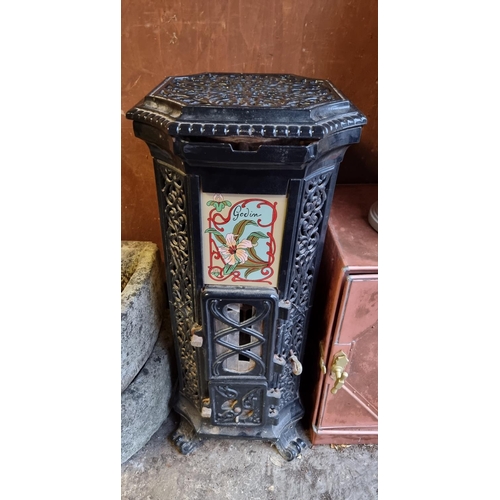 1696 - An old French cast iron stove, 91cm high.