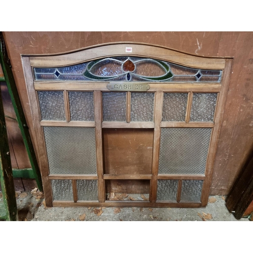 1697 - A walnut and glass 'Cashier' window, 103cm high x 109.5cm wide.