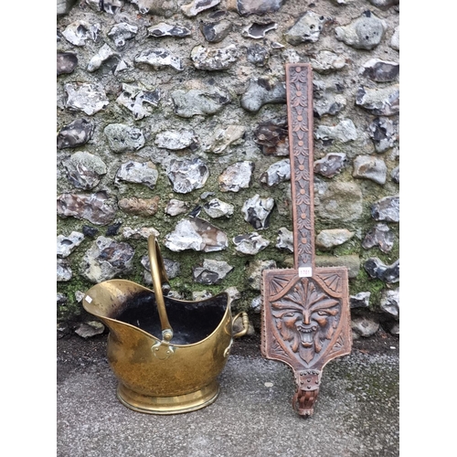 1701 - A pair of late Victorian carved oak 'Green Man' bellows; together with a Victorian brass coal s... 