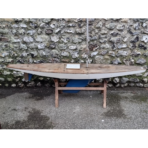 1702 - A large vintage pond yacht, the hull 169.5cm long, on pine stand.