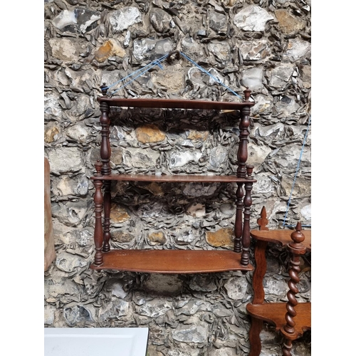 1006 - An old oak hanging shelf, 51cm wide; together with another smaller mahogany example. (2)... 