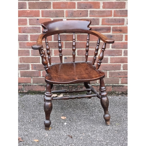 1063 - A Victorian ash and elm smokers' bow chair.