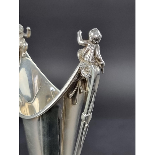 13 - An early 20th century white metal twin handled vase, probably American, height to handles 22.5cm.... 