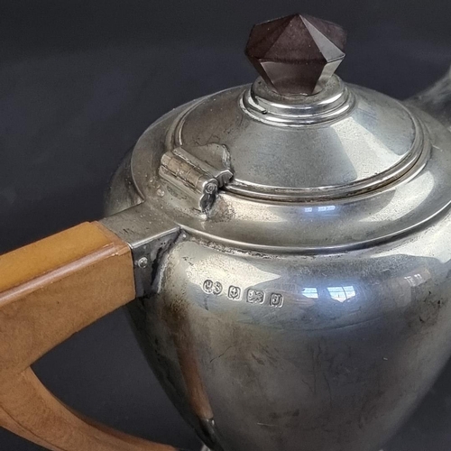 3 - A silver teapot, by Robert Stewart, Birmingham 1933, 17cm high, gross weight 432g.