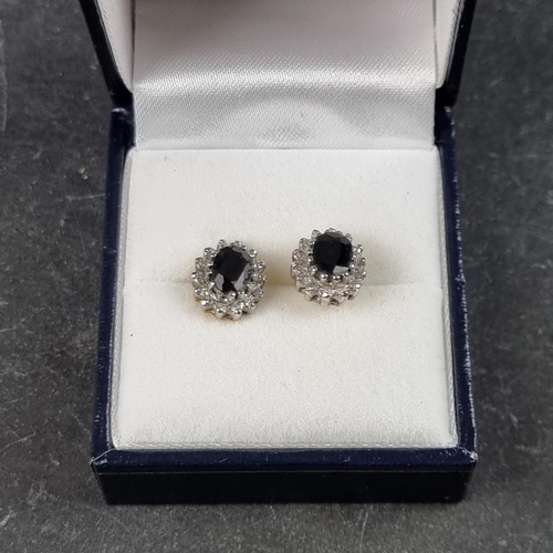 327 - A pair of 9ct gold sapphire and diamond cluster ear studs, 11 x 9mm.