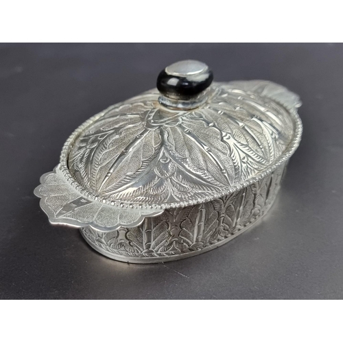 33 - A white metal lidded dish, possibly Persian, with glass liner, 14.5cm wide.